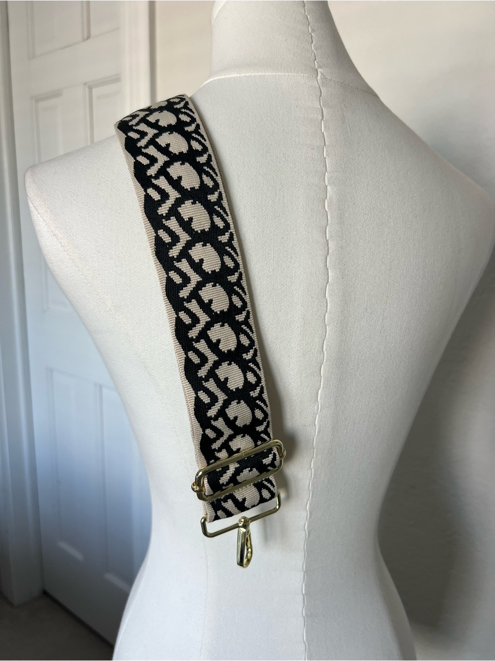 Black and cream geometric patterned detachable purse strap gold hardware